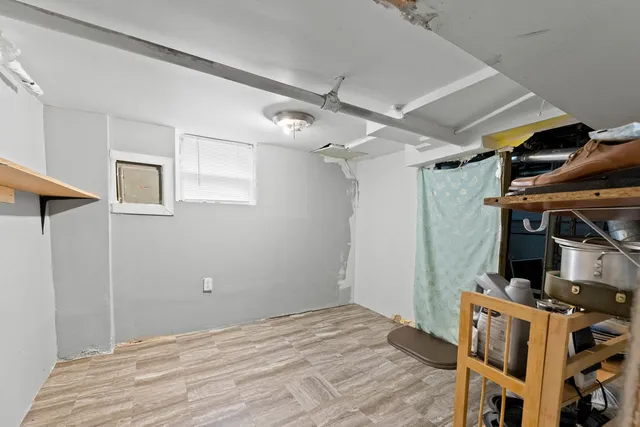 a view of room with wooden floor