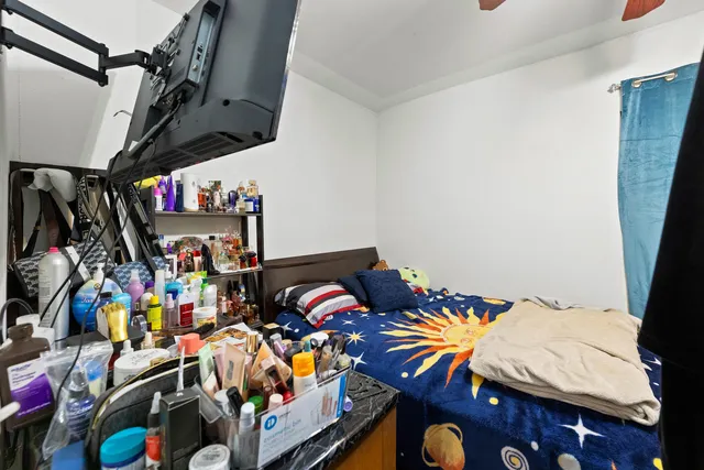 a view of walk in closet with clothes