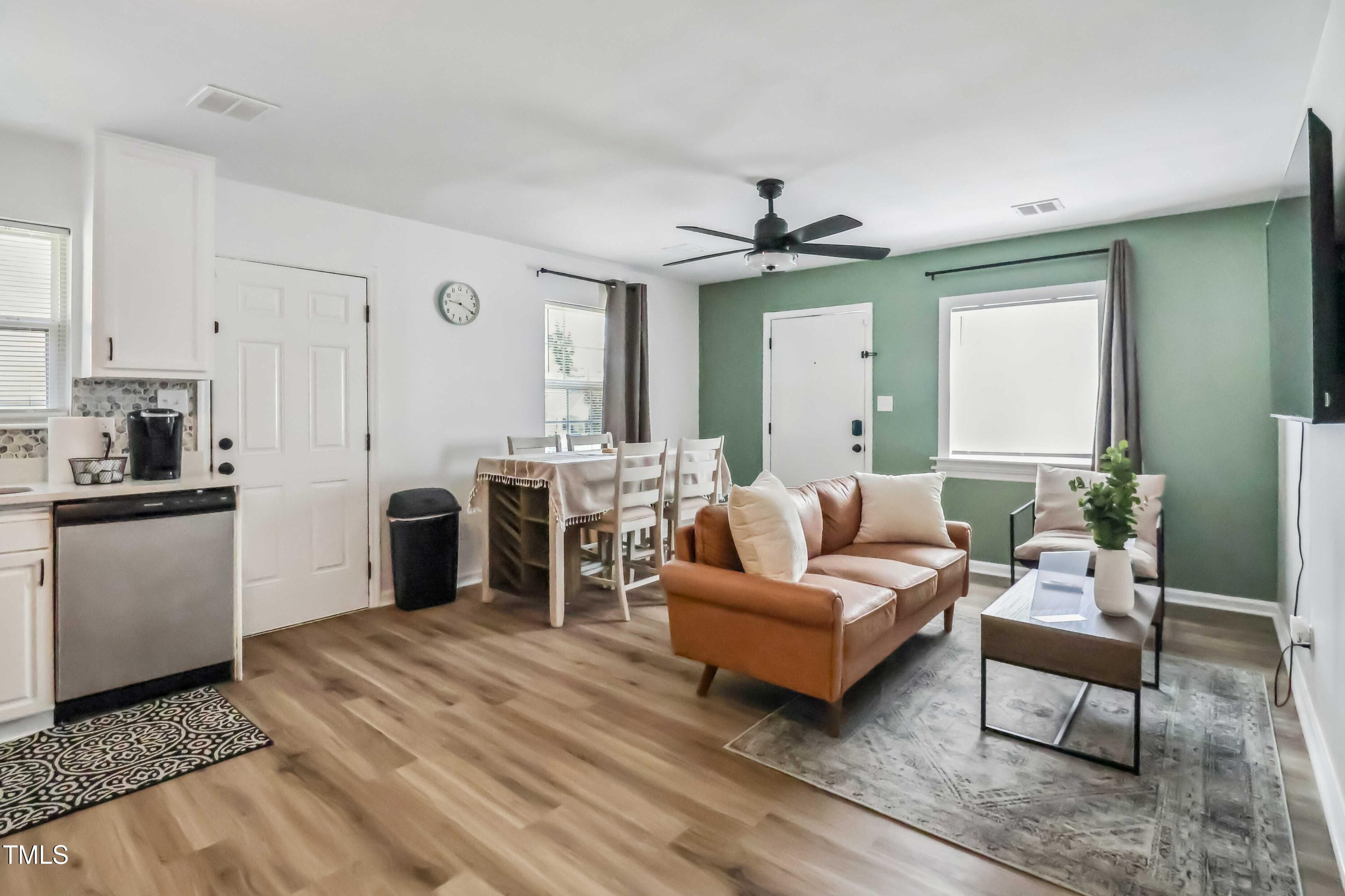 1300 South Street, Unit A Durham, NC 27707 - Photo 3 of 10 a living room with furniture and a fireplace