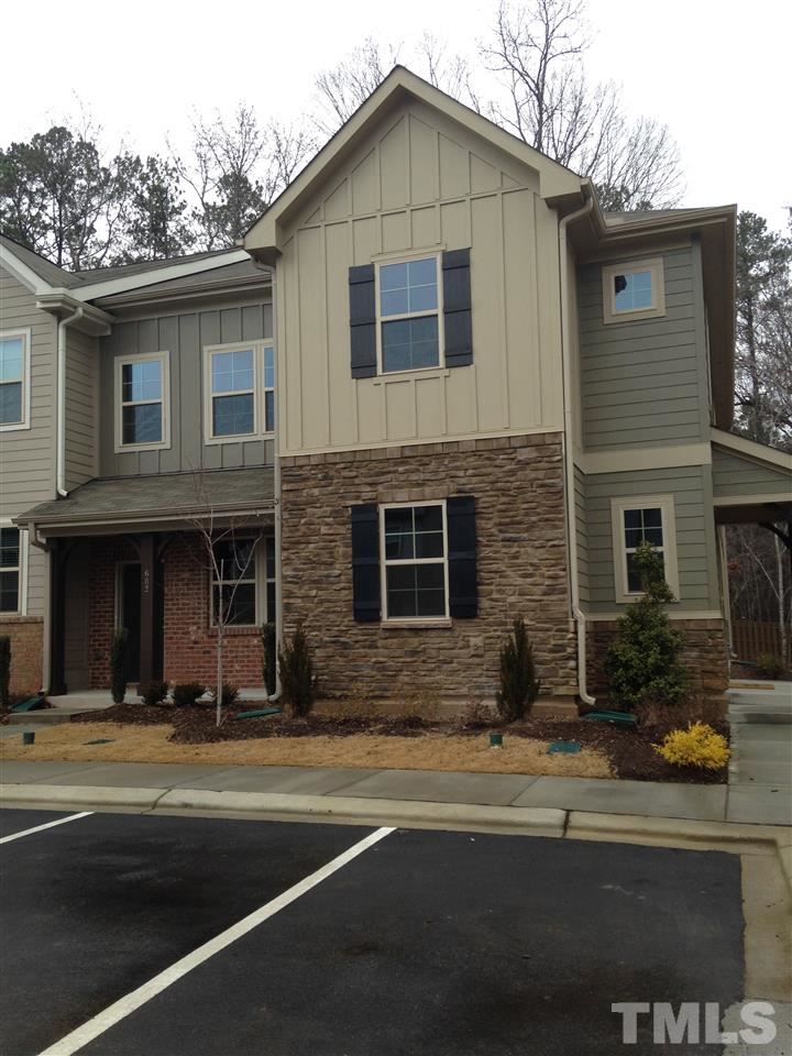 682 Wickham Ridge Road, Unit 145 Apex, NC 27539 - Photo 2 of 25 a view of a house with a outdoor space