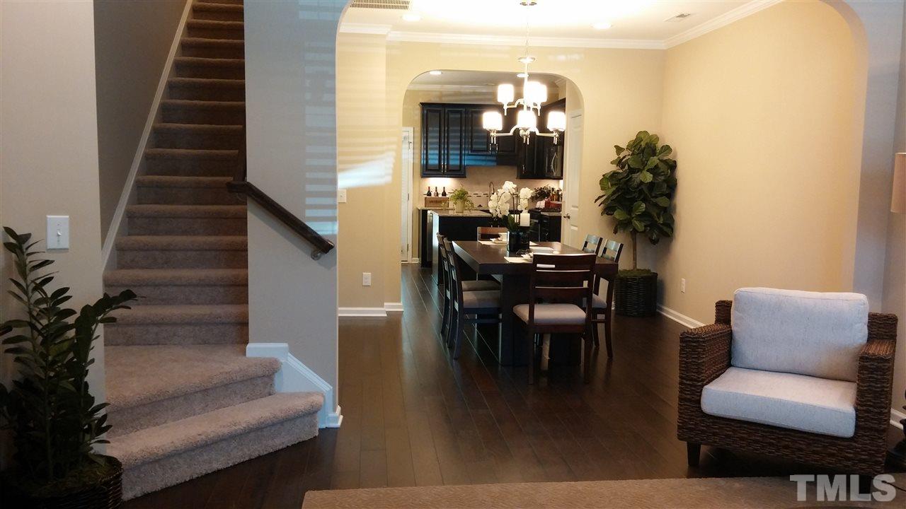 682 Wickham Ridge Road, Unit 145 Apex, NC 27539 - Photo 11 of 25 a view of livingroom and dining room with furniture