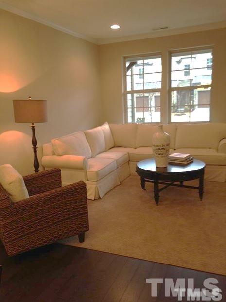 682 Wickham Ridge Road, Unit 145 Apex, NC 27539 - Photo 12 of 25 a living room with furniture and a window