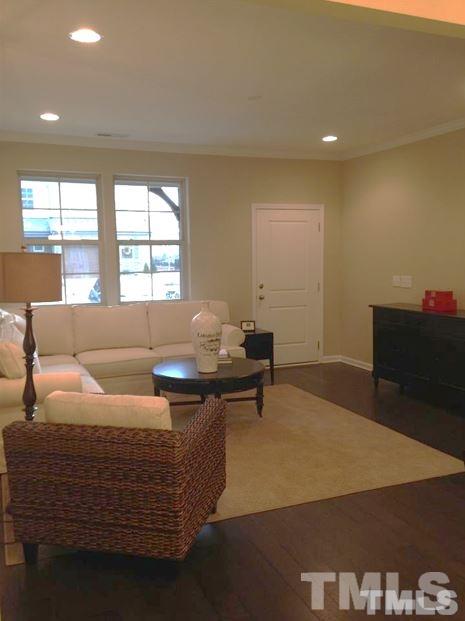 682 Wickham Ridge Road, Unit 145 Apex, NC 27539 - Photo 13 of 25 a living room with furniture and a couch