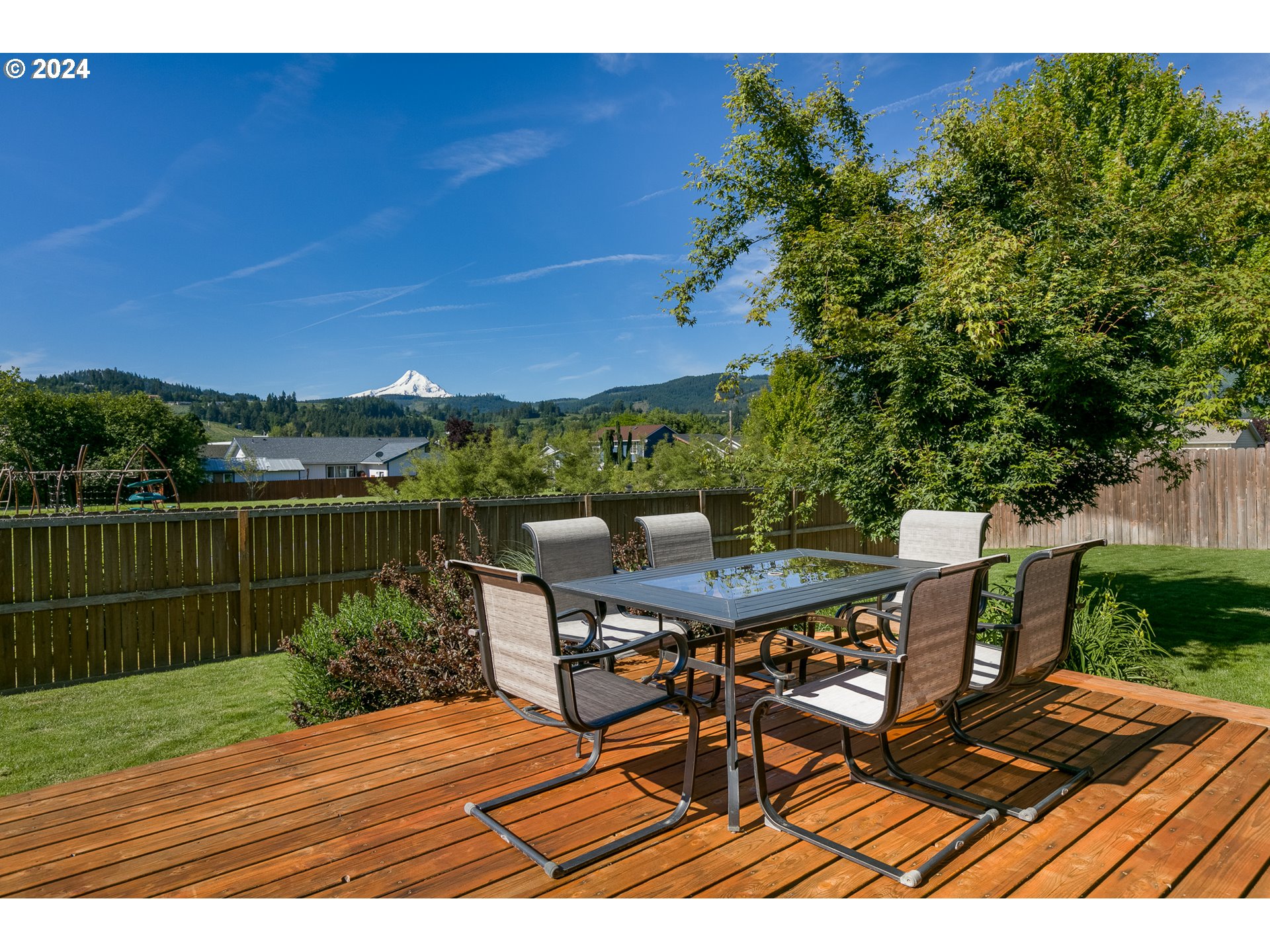 3514 Jones Loop Hood River, OR 97031 - Photo 2 of 34 a view of a patio with table and chairs with wooden floor and fence