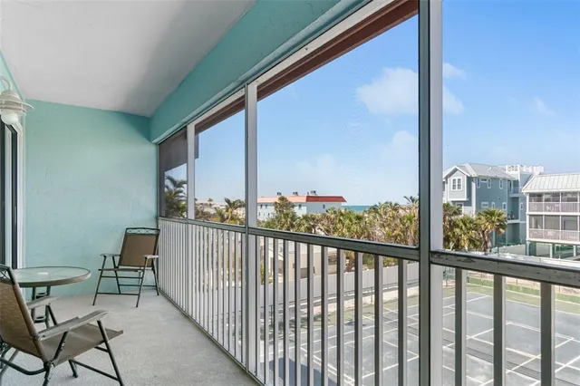 a view of a balcony with wooden floor