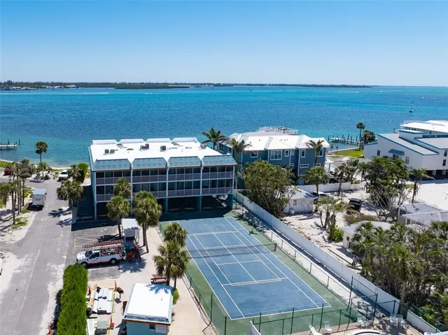 an aerial view of a house with a ocean view