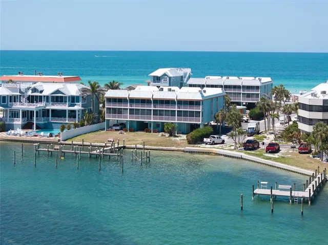 an aerial view of residential building with ocean view