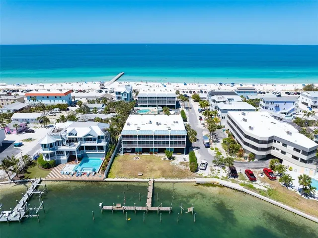 a group of people riding bikes down a street