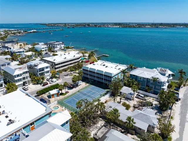 a view of a building with cars parked