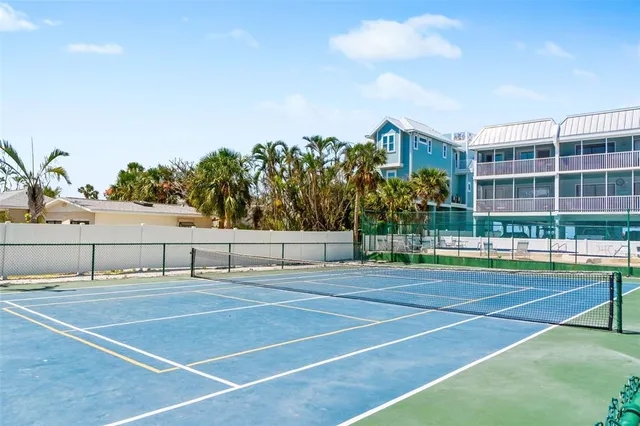 a view of a cafe with a table and chairs in patio