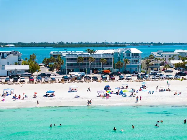 a living room with furniture a flat screen tv and a window