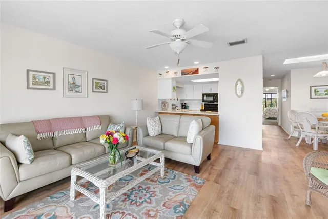 a kitchen with stainless steel appliances a stove a sink and a refrigerator