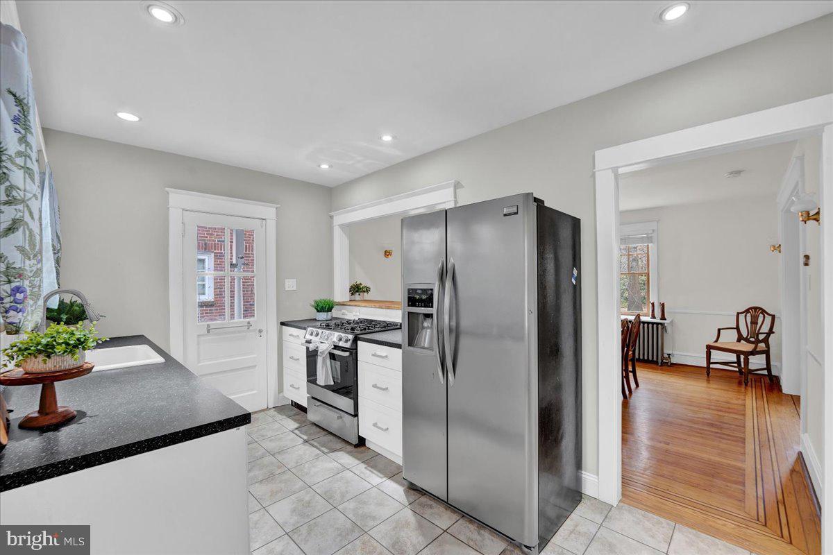209 Hewett Road Wyncote, PA 19095 - Photo 11 of 36 a kitchen with stainless steel appliances granite countertop a refrigerator a stove and a sink