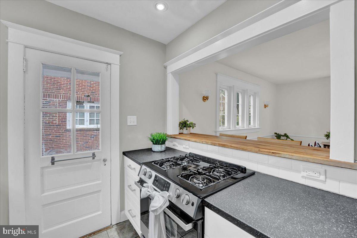 209 Hewett Road Wyncote, PA 19095 - Photo 14 of 36 a kitchen with a stove and a granite counter tops
