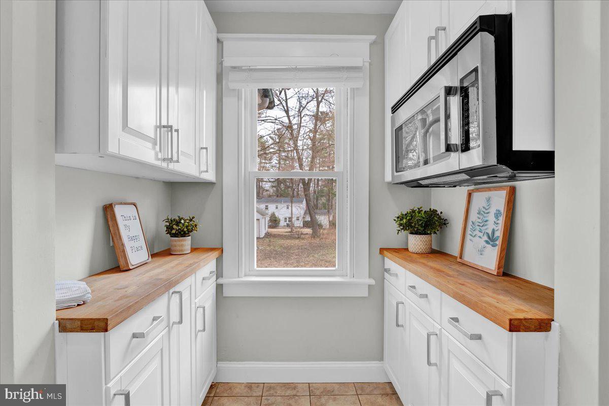 209 Hewett Road Wyncote, PA 19095 - Photo 15 of 36 a view of a kitchen with furniture and window