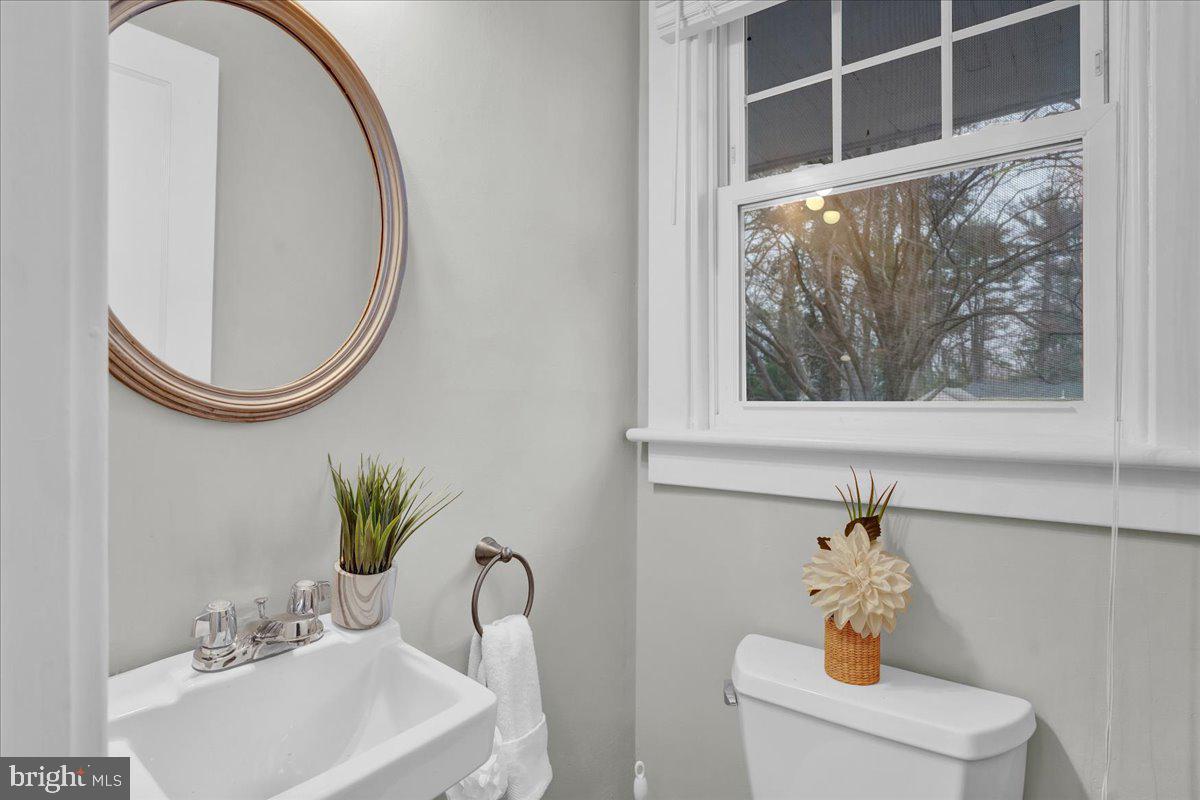 209 Hewett Road Wyncote, PA 19095 - Photo 16 of 36 a bathroom with a sink and a mirror