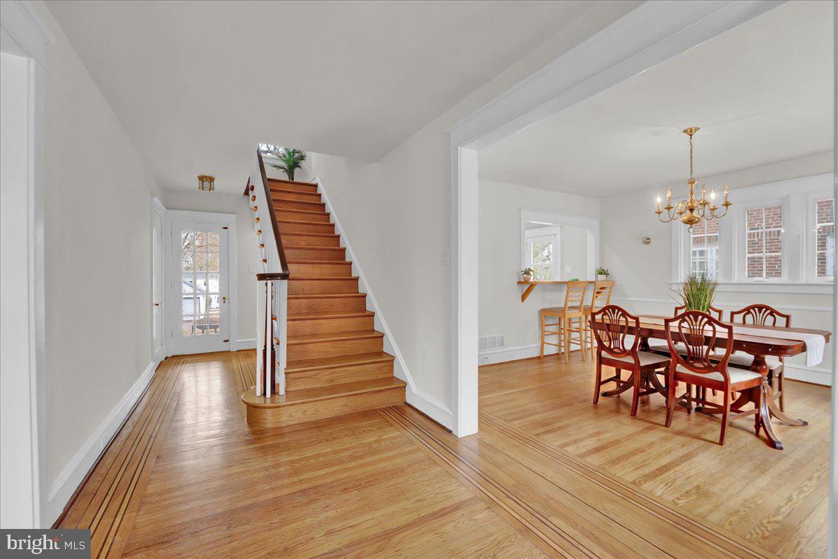 209 Hewett Road Wyncote, PA 19095 - Photo 18 of 36 a view of a dining room with furniture and wooden floor