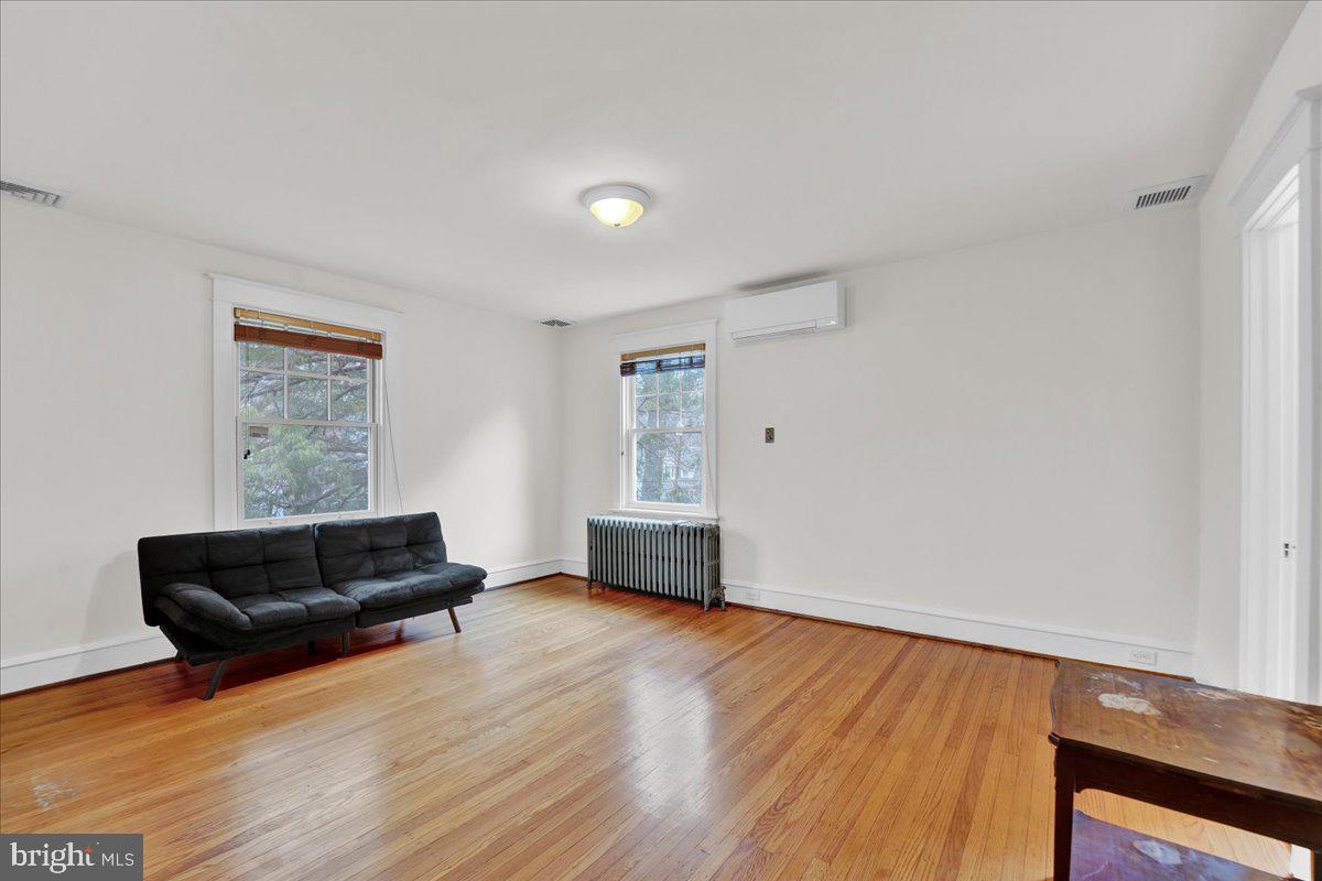 209 Hewett Road Wyncote, PA 19095 - Photo 21 of 36 a living room with furniture and a wooden floor