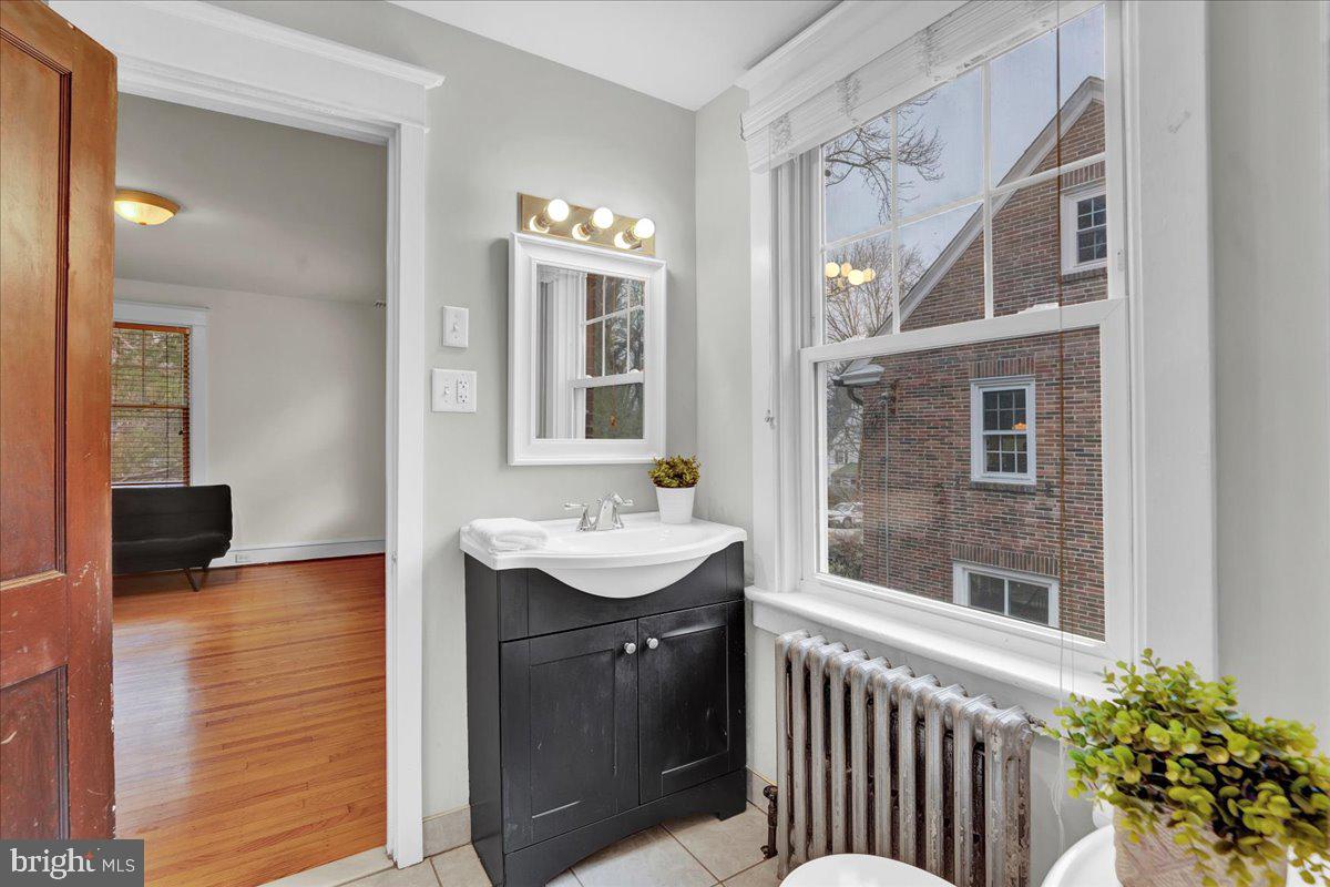 209 Hewett Road Wyncote, PA 19095 - Photo 24 of 36 a bathroom with a sink and a mirror