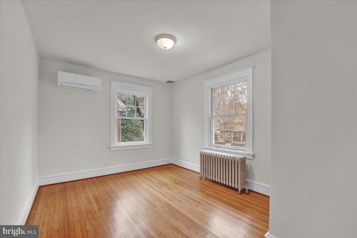 209 Hewett Road Wyncote, PA 19095 - Photo 25 of 36 an empty room with wooden floor and windows