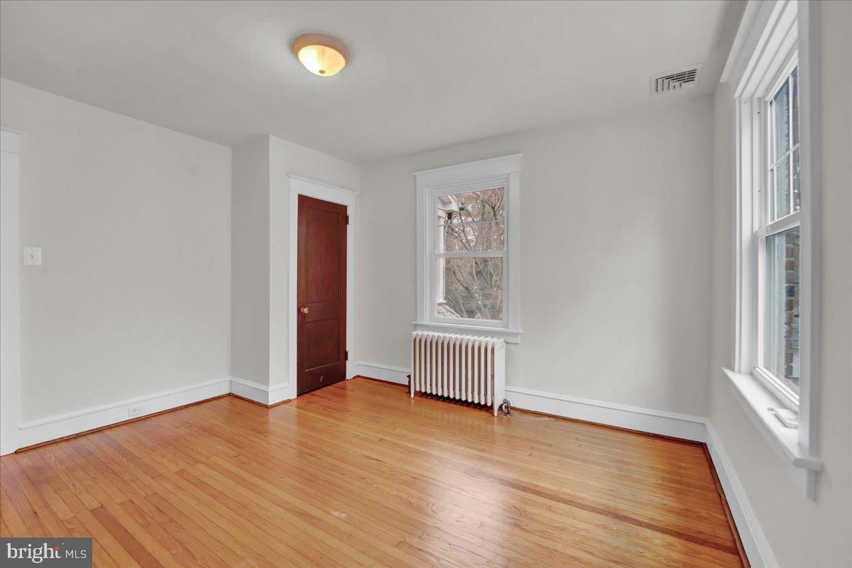 209 Hewett Road Wyncote, PA 19095 - Photo 27 of 36 an empty room with wooden floor and windows