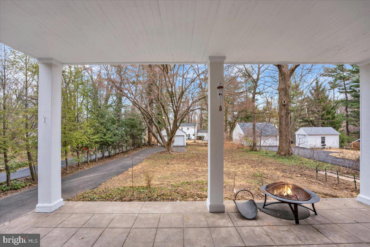 209 Hewett Road Wyncote, PA 19095 - Photo 33 of 36 a view of a porch with chairs and backyard