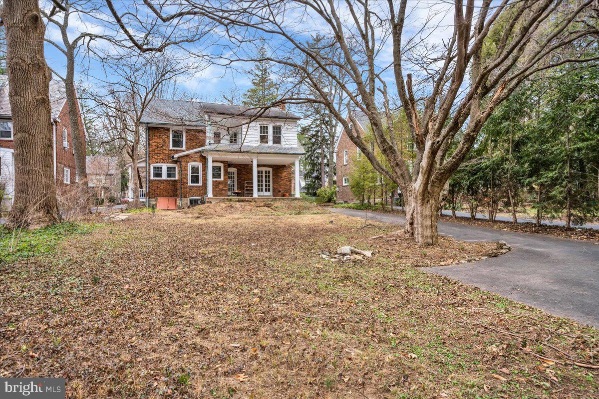209 Hewett Road Wyncote, PA 19095 - Photo 34 of 36 a front view of a house with a yard