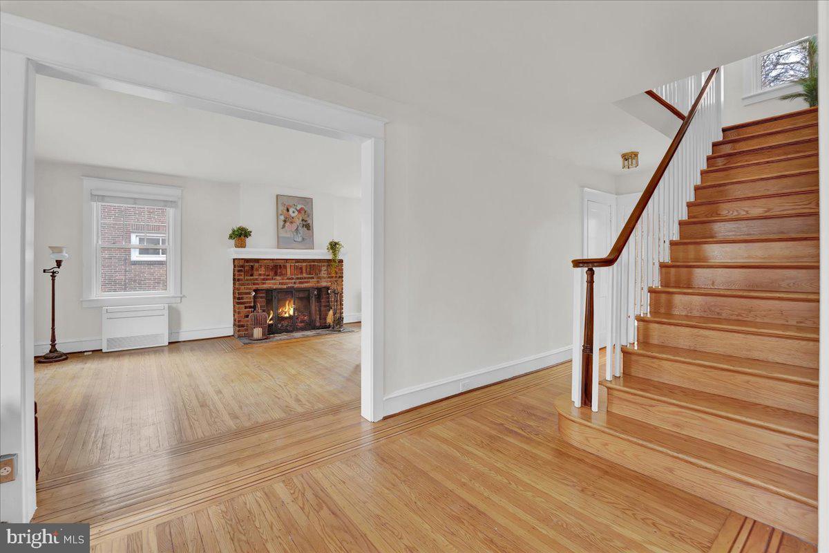209 Hewett Road Wyncote, PA 19095 - Photo 4 of 36 a view of empty room with stairs and wooden floor