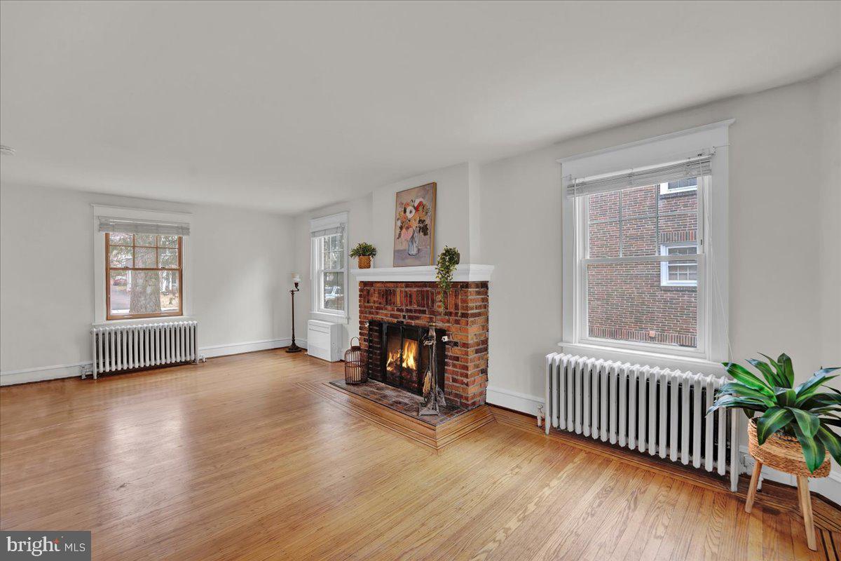 209 Hewett Road Wyncote, PA 19095 - Photo 5 of 36 a view of a livingroom with furniture and a fireplace