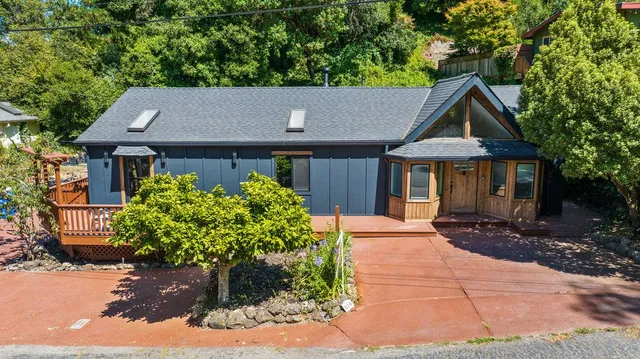 a backyard of a house with potted plants