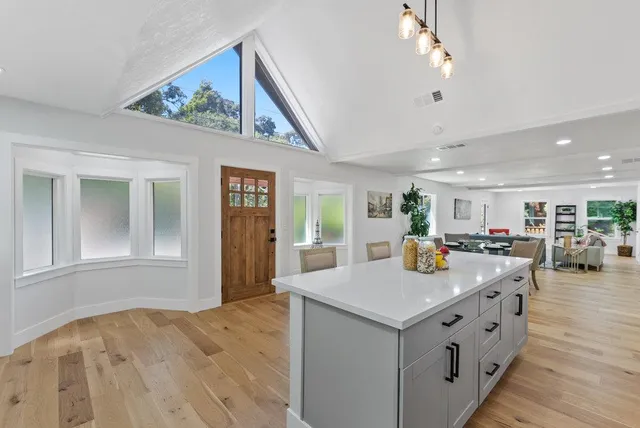 a view of kitchen island kitchen island wooden floor and center island