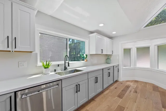 a kitchen with a sink and cabinets