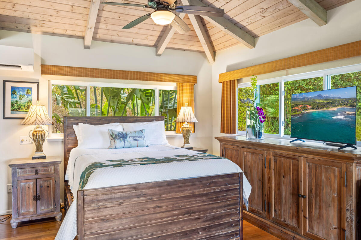 3307 D Hailima Road Koloa, HI 96756 - Photo 11 of 30 a bedroom with a large bed and a large window