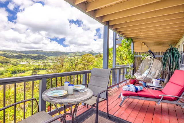 a view of a chairs and table in patio