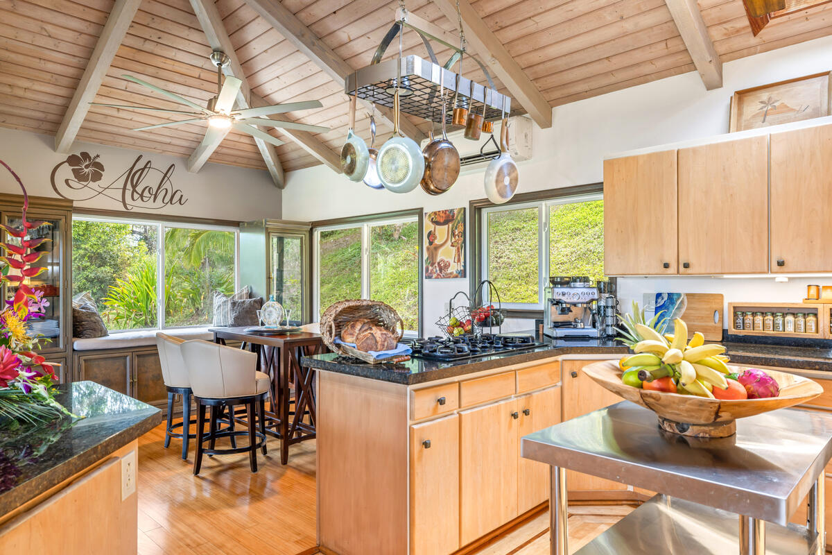 3307 D Hailima Road Koloa, HI 96756 - Photo 4 of 30 a kitchen with a table chairs and outdoor living room