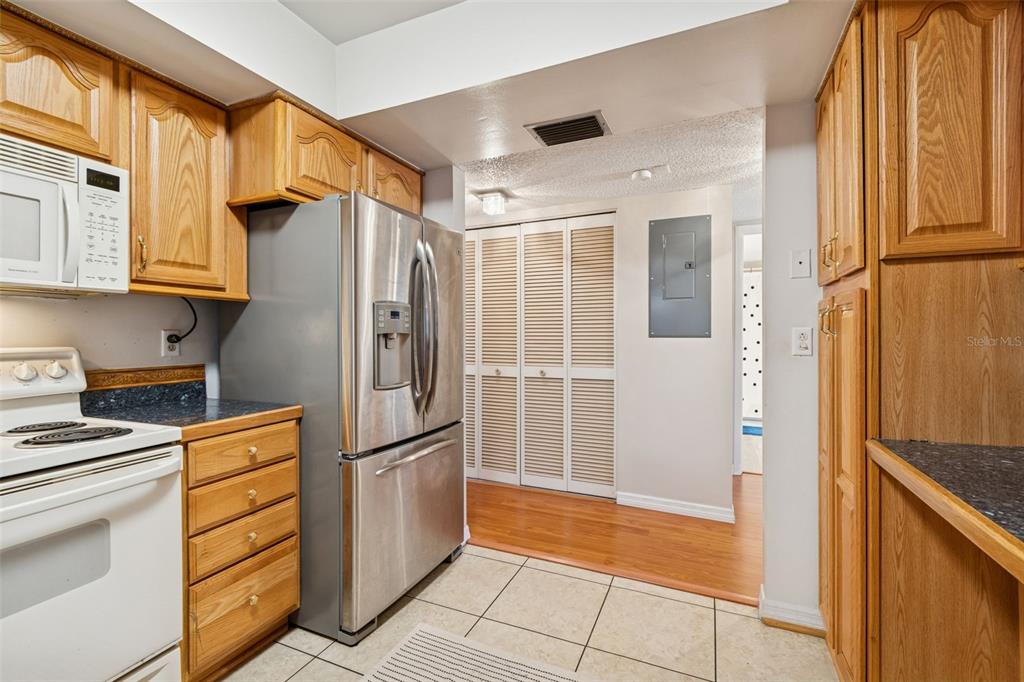 2618 Cedar View Court, Unit 95B Clearwater, FL 33761 - Photo 13 of 43 a kitchen with stainless steel appliances granite countertop a refrigerator and a stove
