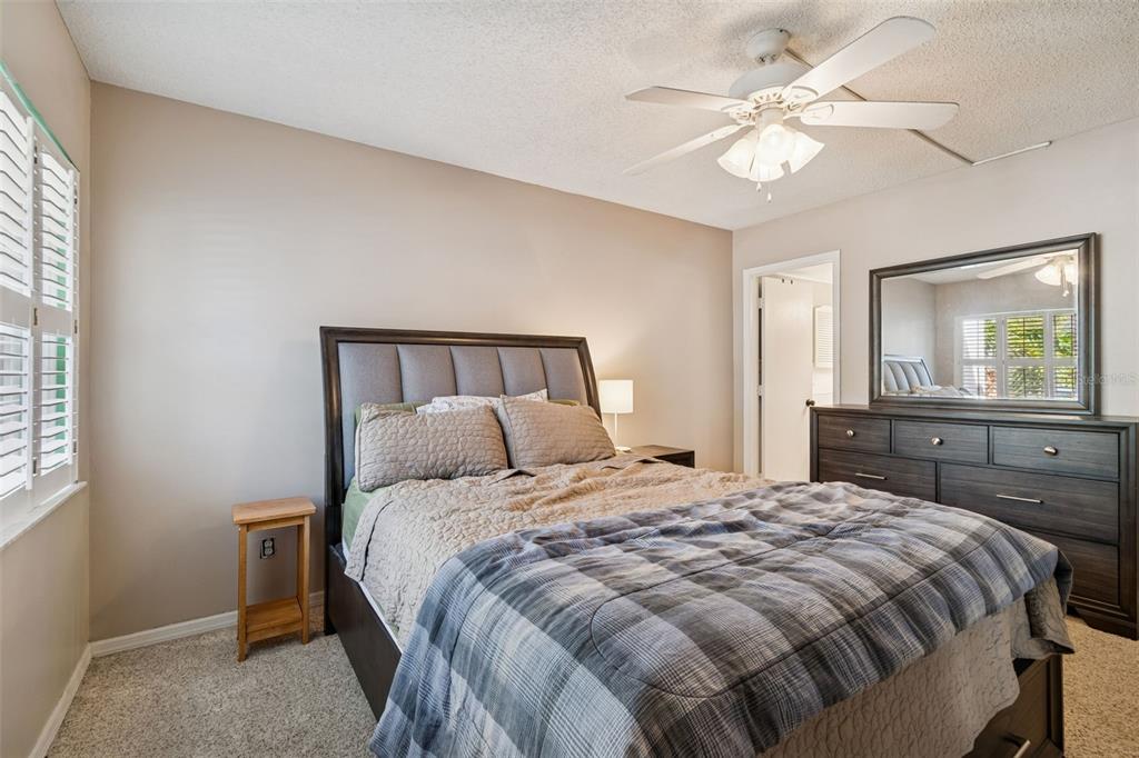 2618 Cedar View Court, Unit 95B Clearwater, FL 33761 - Photo 15 of 43 a bedroom with a large bed and a tv