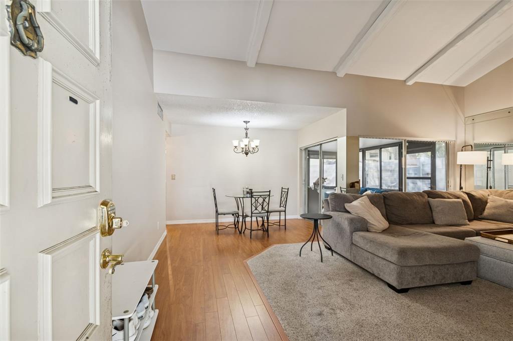 2618 Cedar View Court, Unit 95B Clearwater, FL 33761 - Photo 2 of 43 a living room with furniture and a table