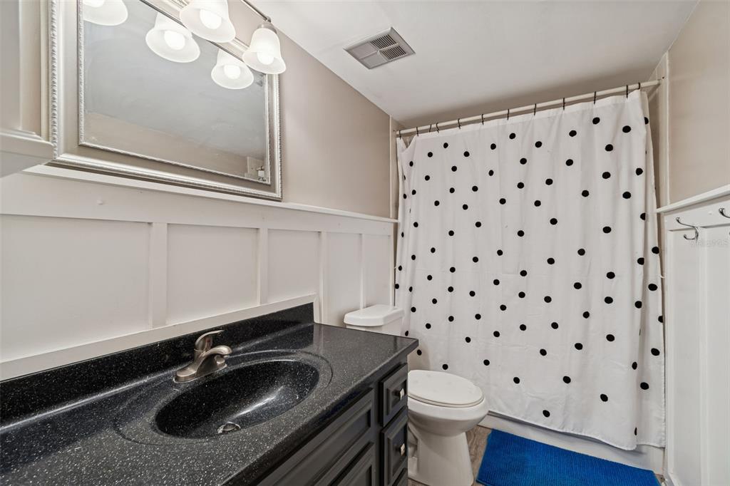 2618 Cedar View Court, Unit 95B Clearwater, FL 33761 - Photo 22 of 43 a bathroom with a sink toilet and a mirror