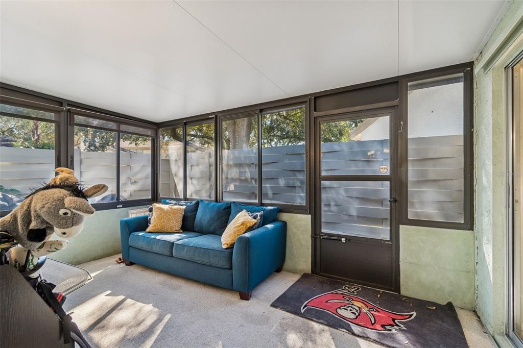 2618 Cedar View Court, Unit 95B Clearwater, FL 33761 - Photo 29 of 43 a bedroom with furniture and a window