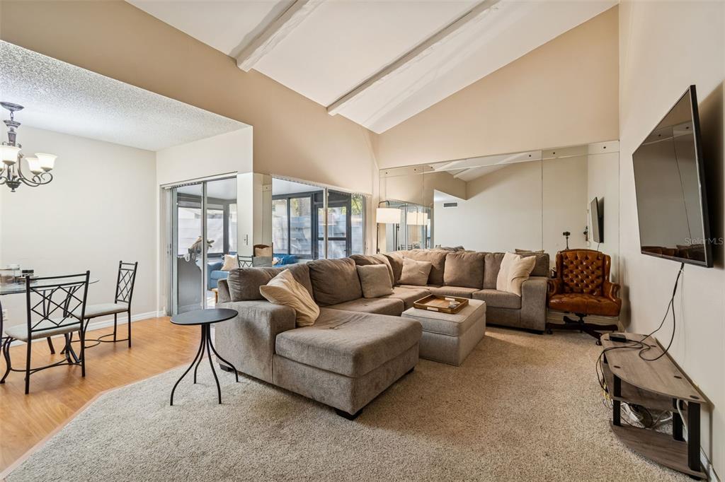 2618 Cedar View Court, Unit 95B Clearwater, FL 33761 - Photo 3 of 43 a living room with furniture and a flat screen tv