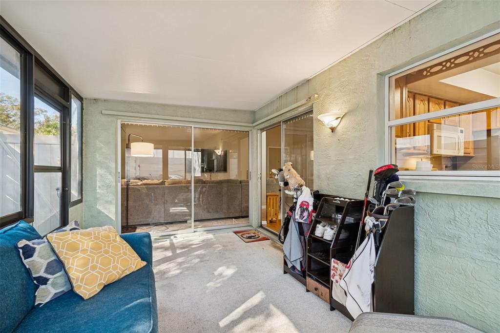 2618 Cedar View Court, Unit 95B Clearwater, FL 33761 - Photo 31 of 43 a room with furniture and a window