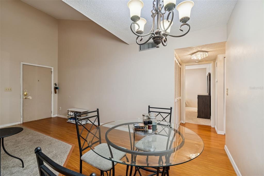 2618 Cedar View Court, Unit 95B Clearwater, FL 33761 - Photo 8 of 43 a dining room with furniture and window