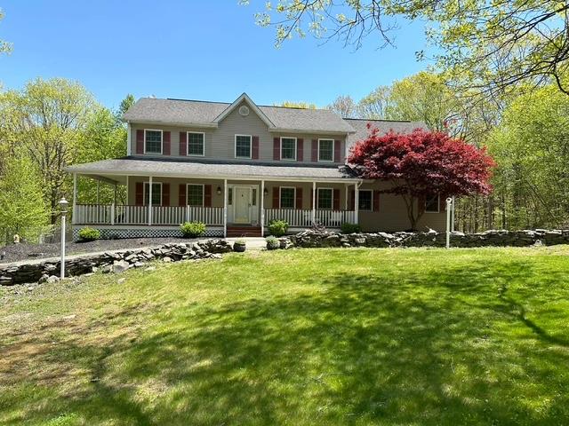 56 Sunset Ridge Monroe, NY 10950 - Photo 1 of 1 a front view of a house with a yard table and chairs
