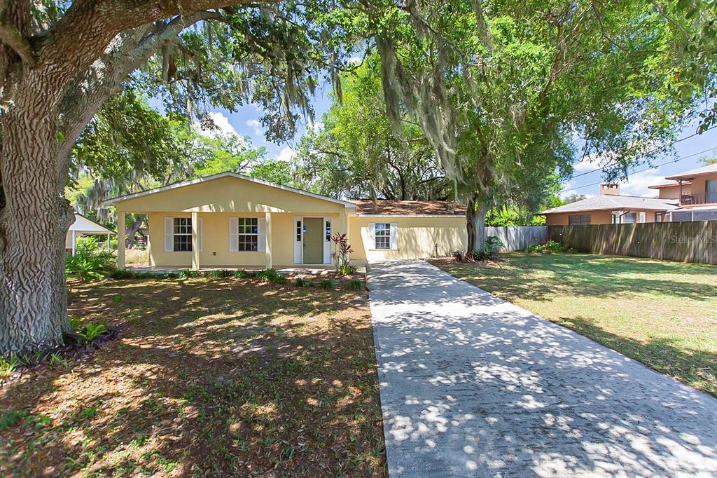 210 Bridges Road Polk City, FL 33868 - Photo 1 of 1 a front view of a house with a yard