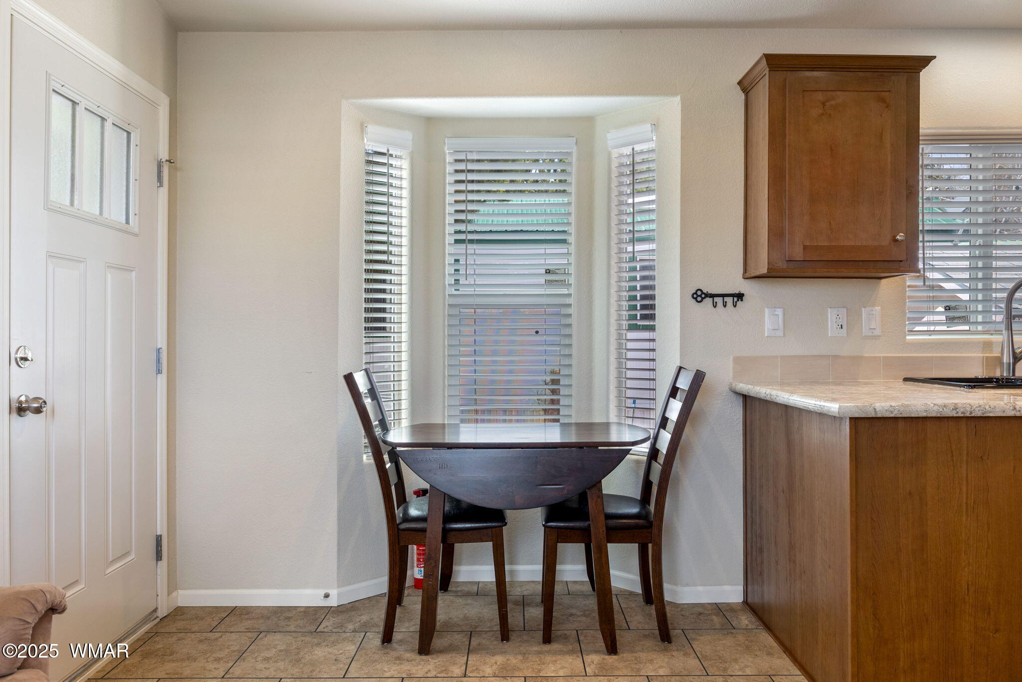 2206 Wrangler Way Overgaard, AZ 85933 - Photo 11 of 38 a dining room with furniture and window