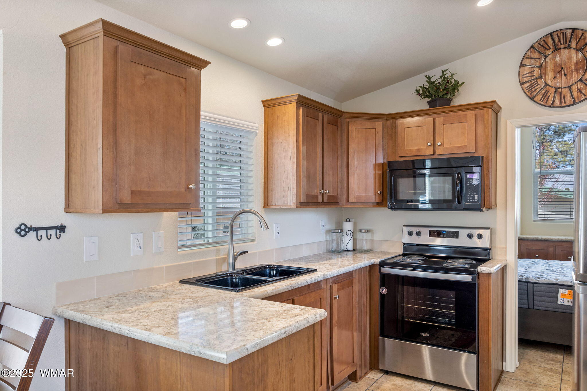 2206 Wrangler Way Overgaard, AZ 85933 - Photo 12 of 38 a kitchen with a stove a sink and a microwave