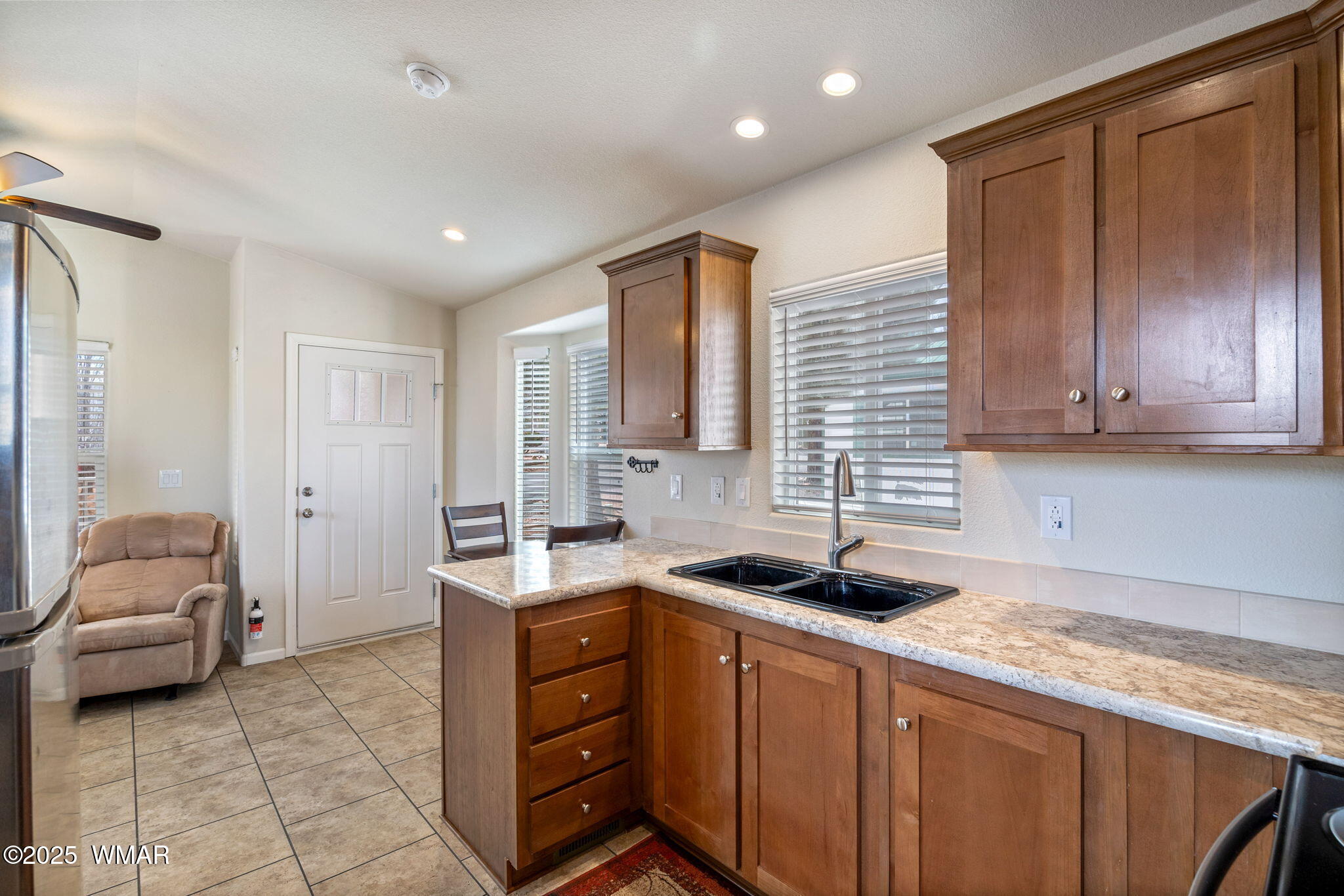 2206 Wrangler Way Overgaard, AZ 85933 - Photo 13 of 38 a kitchen that has a sink and a stove in it