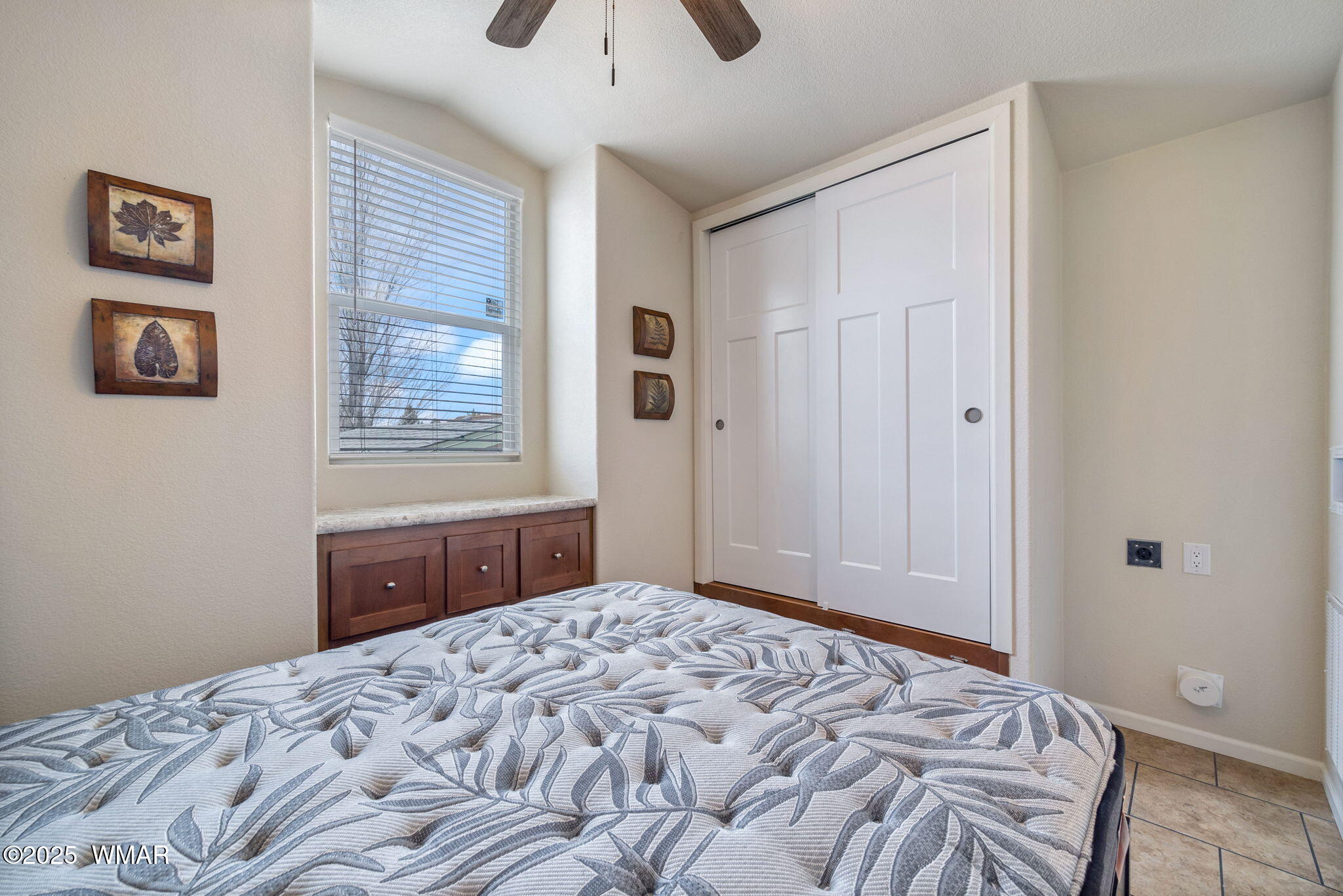 2206 Wrangler Way Overgaard, AZ 85933 - Photo 14 of 38 a bedroom with a bed and a window