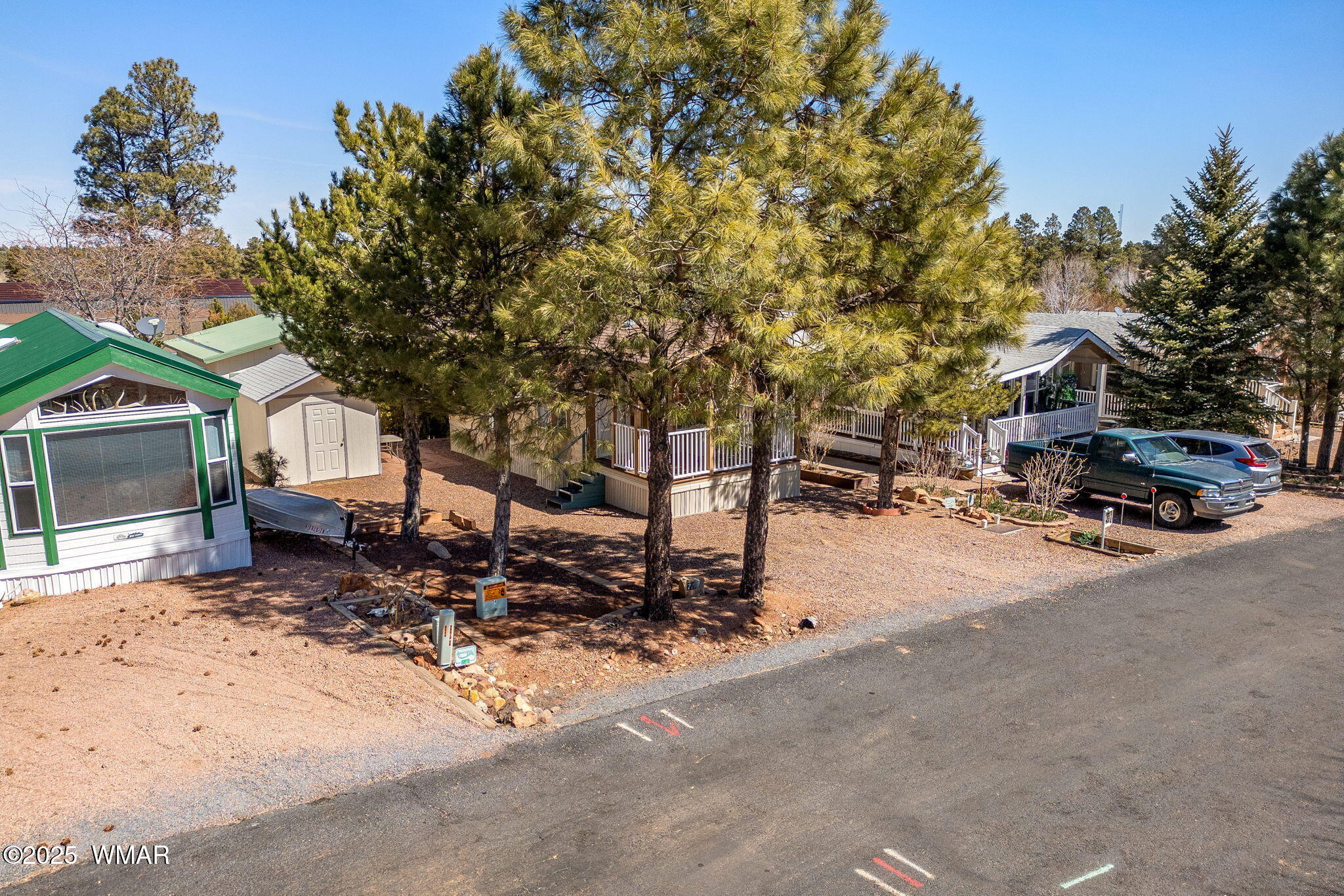 2206 Wrangler Way Overgaard, AZ 85933 - Photo 19 of 38 a row of car parked in front of a house